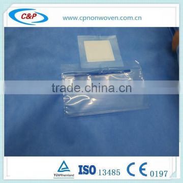 Eye drape with adhesive fenestration