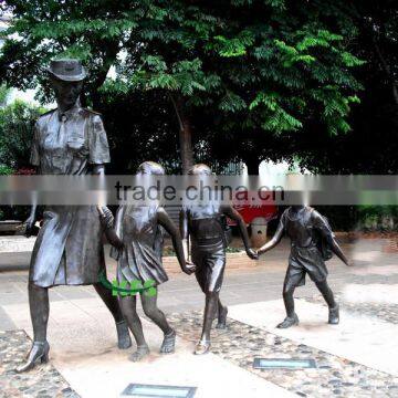 Bronze school sculptures of teacher and students