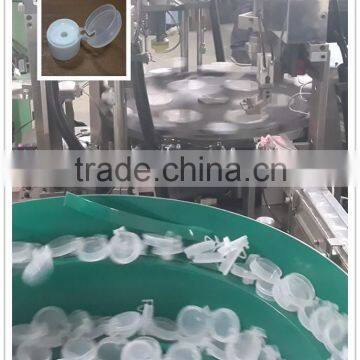 Automatic plastic cap assembly manufacturing machine