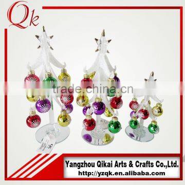 White handmade glass christmas tree with beautiful ornaments