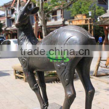 Bronze street side put baby deer sculpture