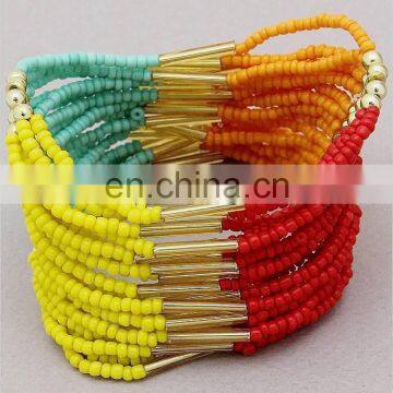 MULTI STRAND MULTI COLOR GLASS SEED BEAD GOLD TONE BEAD STRETCH BRACELET
