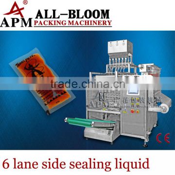 Multi lane liquid filling and packing machine