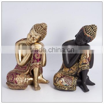 Beautiful lying buddha statue with fabric clothes ,Peaceful buddha statue