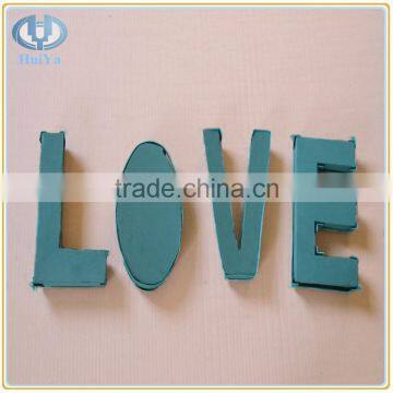 wet green floral foam letters with plastic case