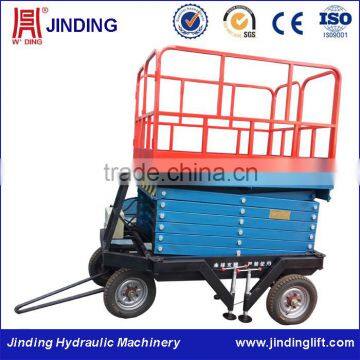 Four-wheel hydraulic trailed scissor lifting platform machine