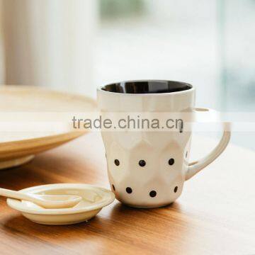 White ceramic coffee mug with dot