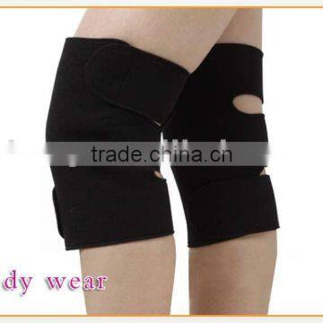 Self-heating massage knee pad