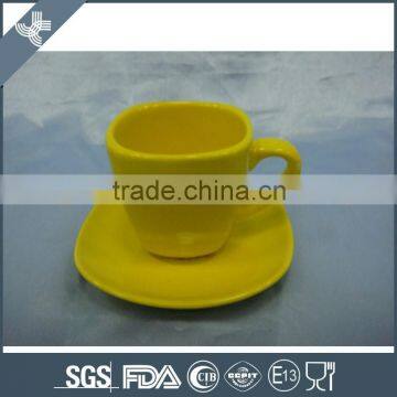 Model design with beautifu yellow color coffee cup and saucer