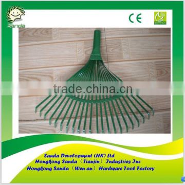 green painted leaf raking tools