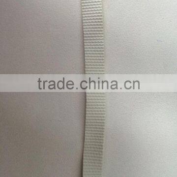 Textured natural rubber elastic tape for swimwear