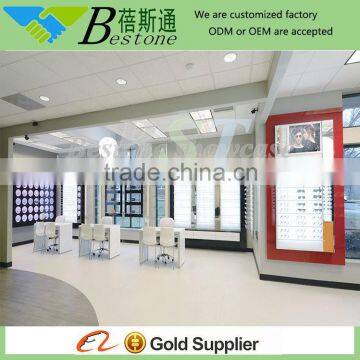 retail optical shop interior wooden wall shelf design