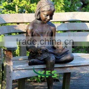 Bronze modern girl studying on bench sculpture