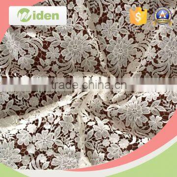 Lovely embroidery floral figures milky poly customized guipure lace fabric                        
                                                                                Supplier's Choice