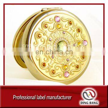 Hot Sale Popular Items Custom Made 70mm Company Souvenir Embossed Design Shiney Gold Metal Crystal Cosmetic Mirror