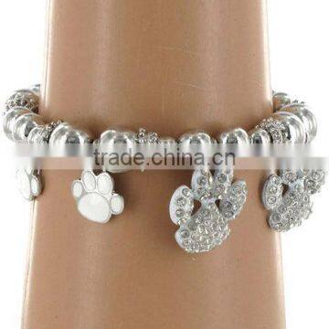 White Enamel And Rhinestone Setting Paw Print Charm Stretch Bracelet