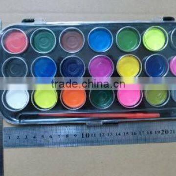 Watercolor paints set with plastic palette and a brush