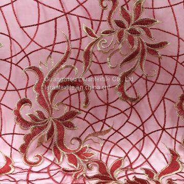 China manufacture Africa gold giltter tulle net embroidered lace fabric for wedding