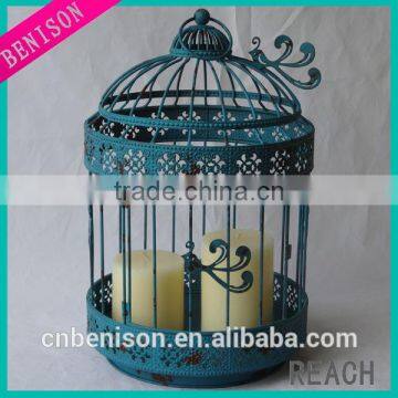 Big antique blue decorative metal birdcage with glass candle holder