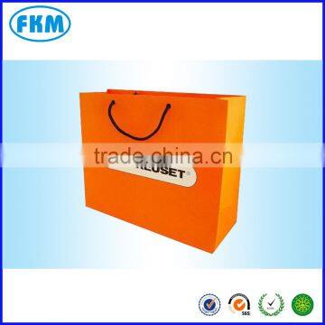 orange color paper handle bag