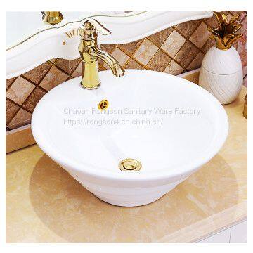 Latest art design white color ceramic shell good sale abovecounter cabinet washing art sink