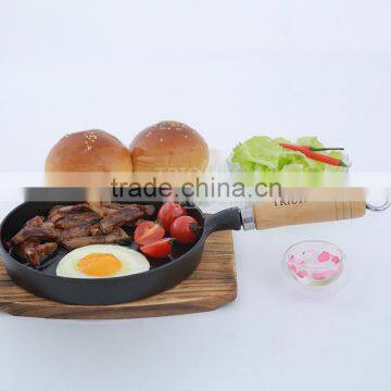 Mini round cast iron frying pan with wooden handle