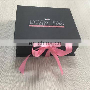 Elegant black save space gift box with shiny pink ribbon for sexy bra packed