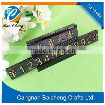 Black plastic store price badges and tags with national money sign of stamped making skill with a nice stander for it