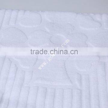 piece dyed solid color jacquard hotel bath mat embossed logo