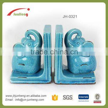 glazed ceramic elephant book stand, carved wooden elephants for book