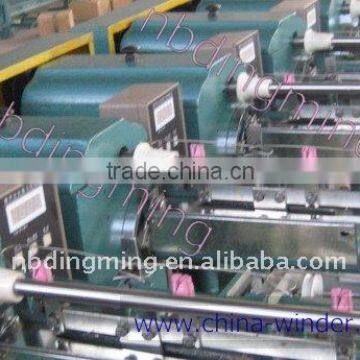 Thread winding machinery for king spool bobbin.