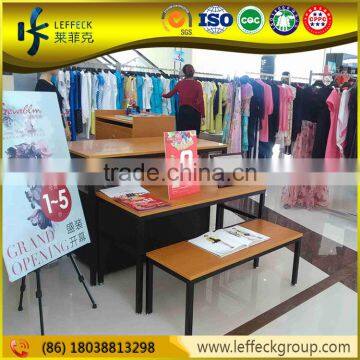 Retail boutique clothing store furniture wooden display clothing racks / table