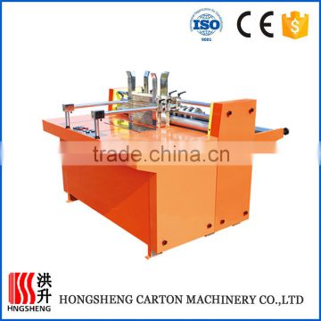 High speed corrugated paperboard division plate machine