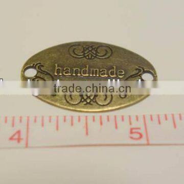 antique engraved brass name badge, oval metal label, copper metal logo