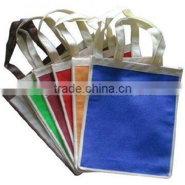 Nonwoven handled bag