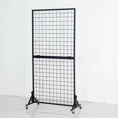 Two grid wall displays with legs in a black grid wall panel group