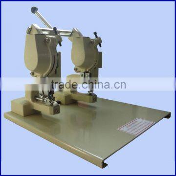 Semi-automatic two head eyelet punch machine