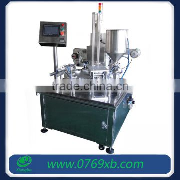 Rotary plastic cup sealing and filling machine