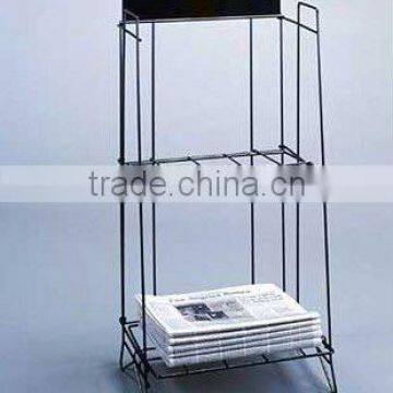 black broad sheet newspaper rack