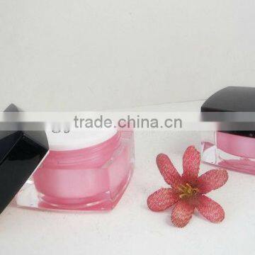 face cream jar with black cap