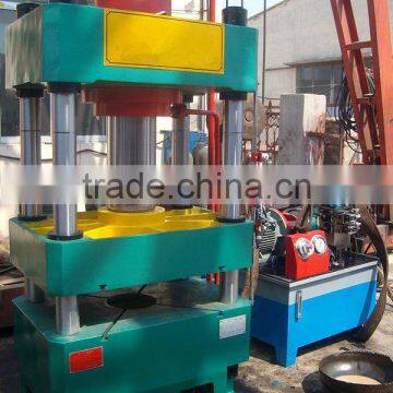 Sheet metal drawing machine for cookware