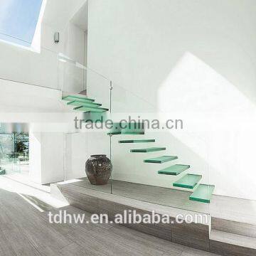 Contemporary floating staircase with open glass treads