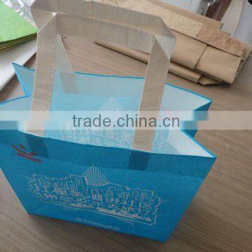 colored shopping kraft paper bag with ribbon handle