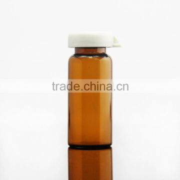 empty pharmaceutical glass bottle with cap