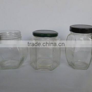 hexangular clear glass bottles with tin lid