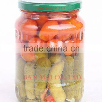 Mixed cucumber and cherry tomato in glass jar
