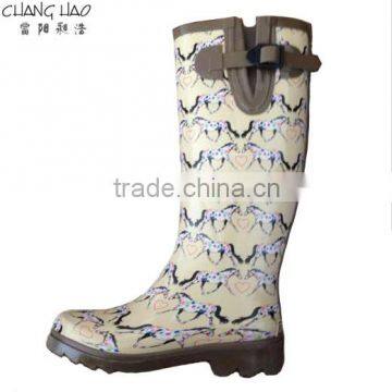 Women fashion rubber rain boot has horse printed with brown sole