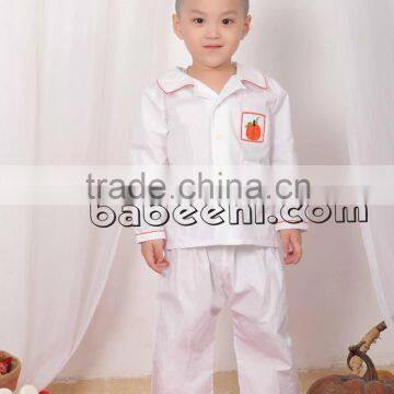 Pumpkin hand smocked pajamas for little boy on Halloween
