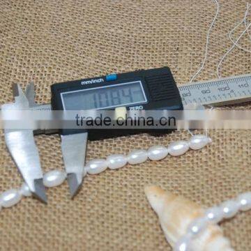 7-10 mm White Rice Shape Freshwater Pearl Strand photo-4
