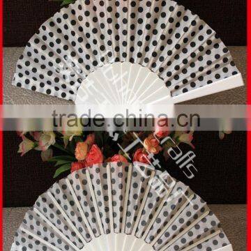 Plastic hand fan with dot design